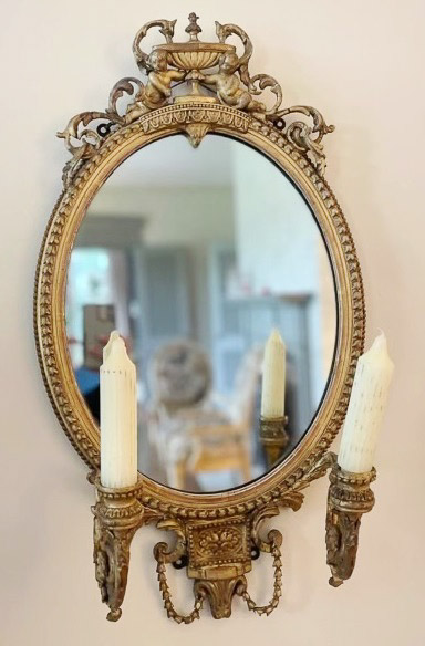 009c - Pair of Victorian wall mirrors with double candeholders and cupids on the crown, 24 in. T.